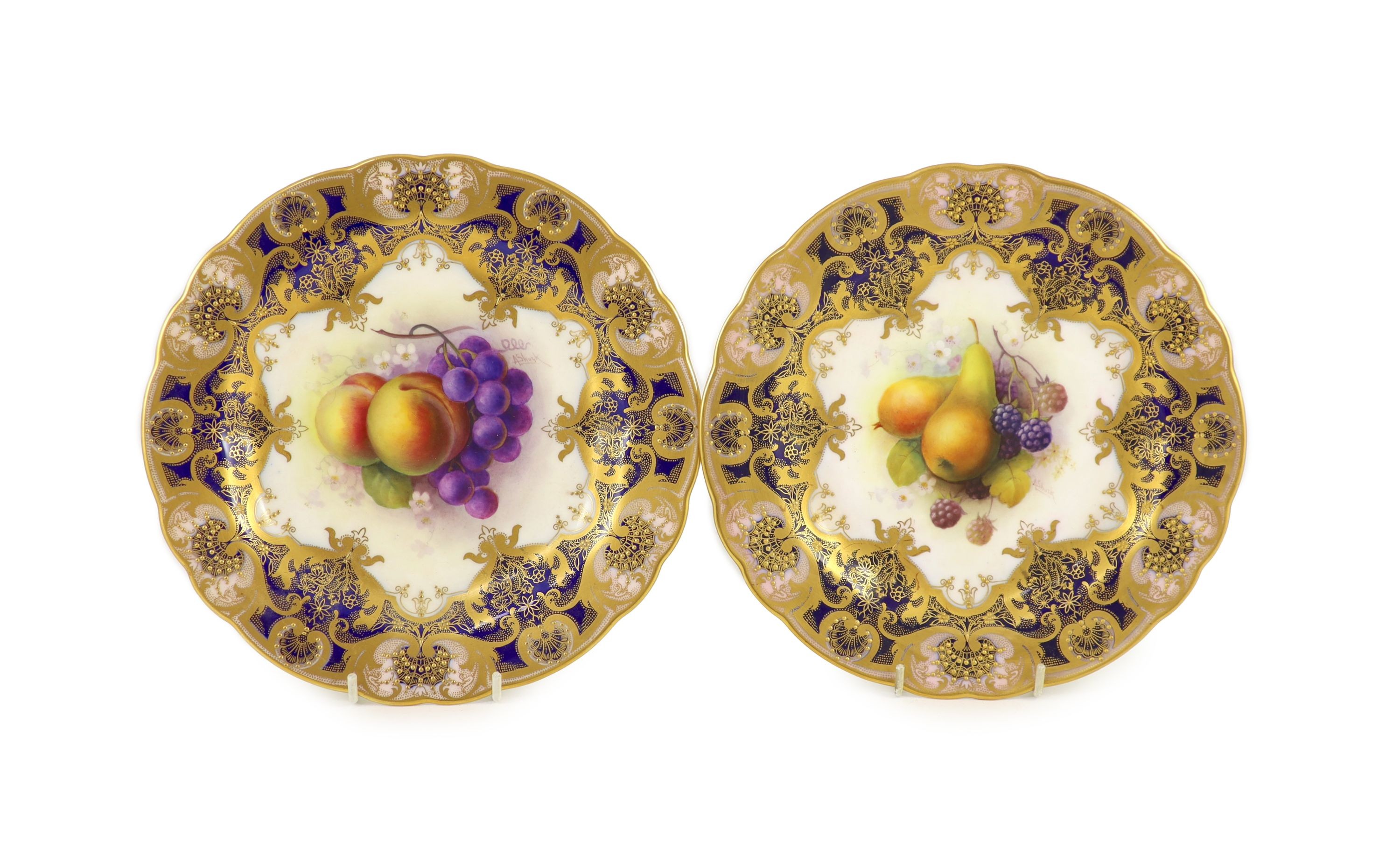 A pair of Royal Worcester fruit painted dessert plates, signed A. Shuck, c.1918, 22.5cm diameter